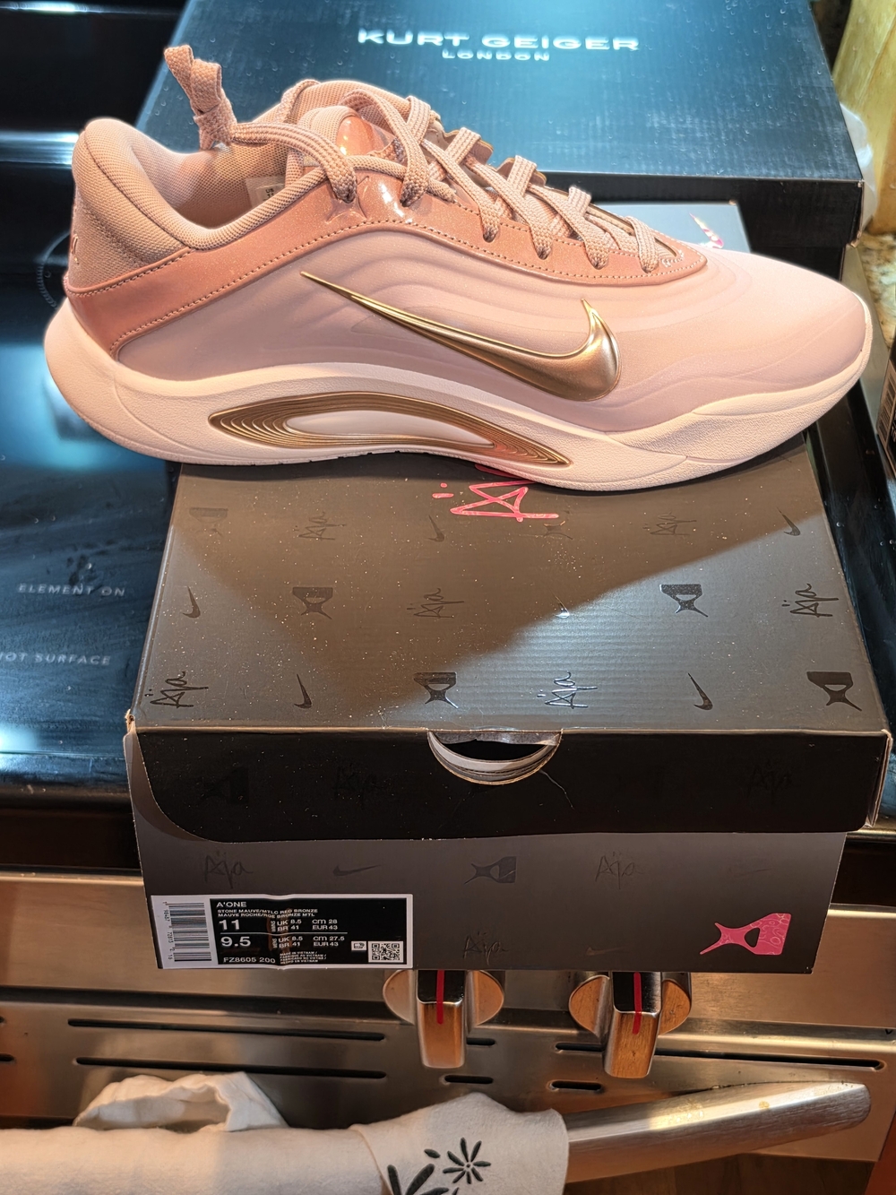 Nike Women’s Pink Athletic Sneaker with Metallic Gold Swoosh